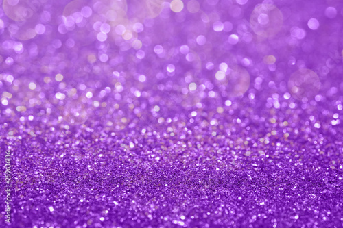 Abstract composition. Purple glitter light background with beautiful bokeh