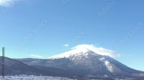 Wallpaper Mural Snowed Rtanj mountain under blue sky 4K drone video Torontodigital.ca