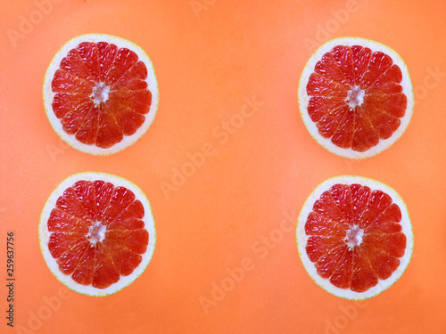 grapefruit on a oranj background photo