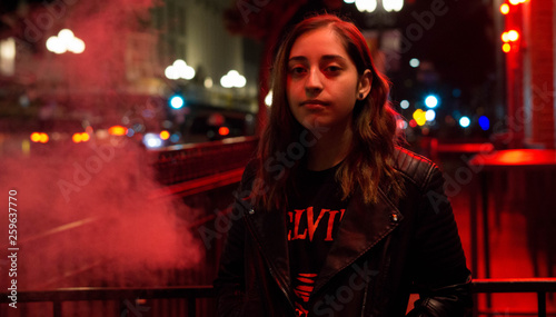 portrait of woman in the city red smoke