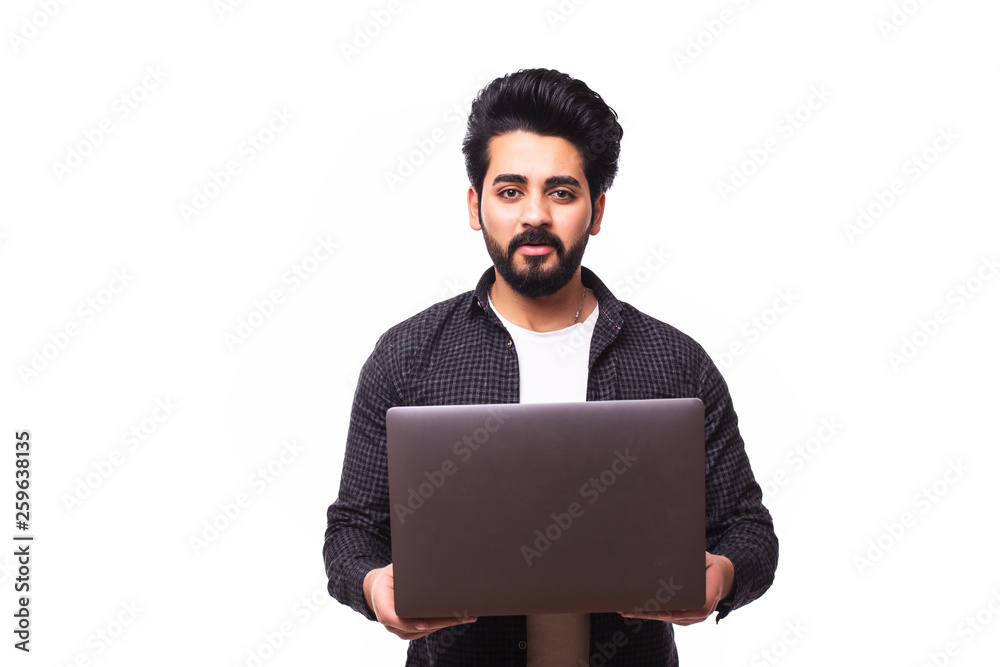 Portrait of handsome bearded arabic man with laptop isolated on white background Portrait of handsome bearded arabic man with laptop isolated on white background