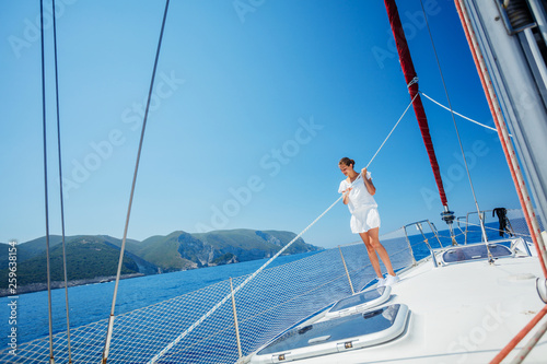 Beautiful Girl relaxing On Yacht in Greece