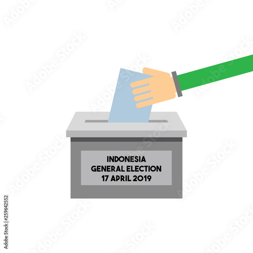 Hand putting a voting ballot in a slot of box in general election of Indonesia on 17. april 2019