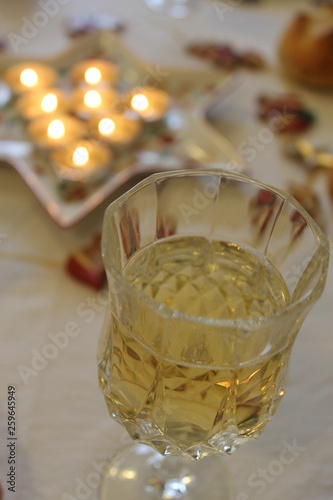 glass of champagne and candlelight