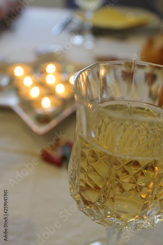 glass of champagne and candlelight