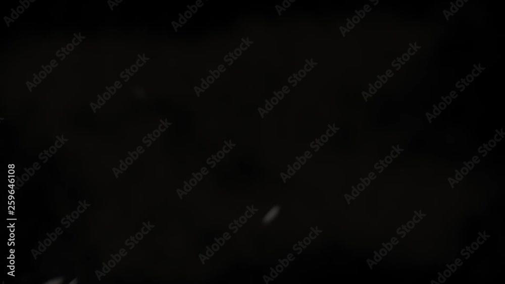 White rice grains bouncing against camera and falling on black background. Pile of cereal rice seeds flies in slow motion