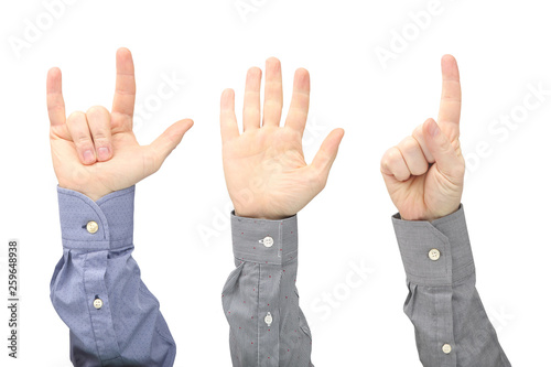 Raised hands of different men on white background