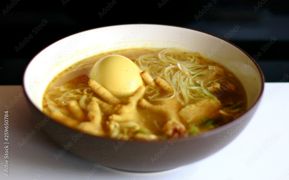 Soto ceker or chicken feet soup on white background. Soto ceker or chicken feet soup on white background.