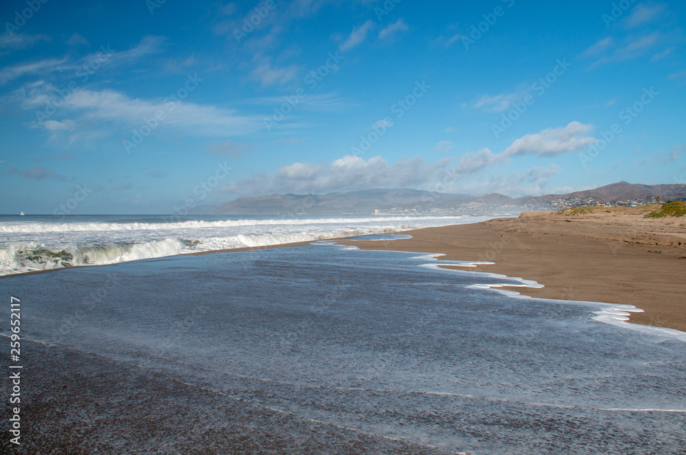 White wave sea water overflowing into Santa Clara river mouth estuary in Ventura California United States White wave sea water overflowing into Santa Clara river mouth estuary in Ventura California United States
