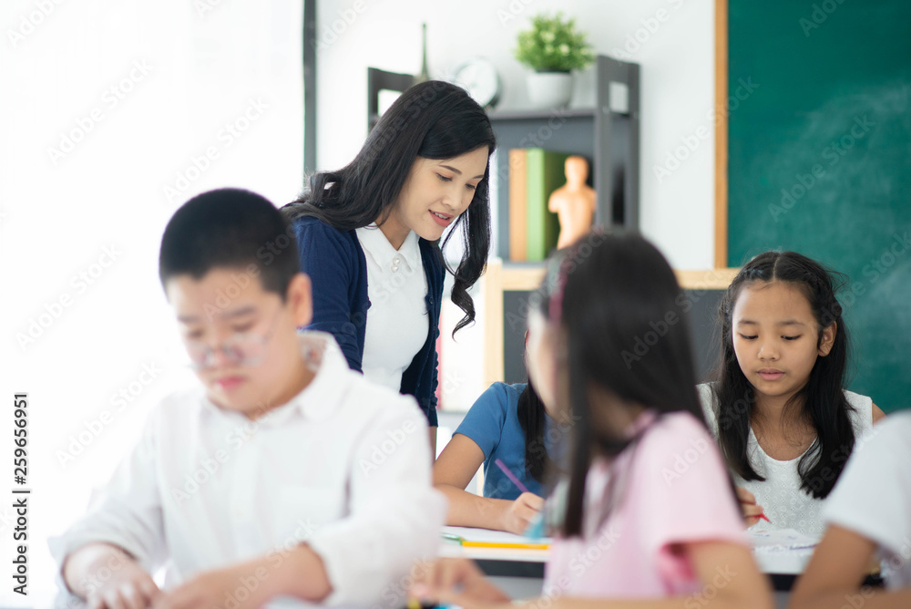 Group of Students study math with teacher in the classroom Group of Students study math with teacher in the classroom
