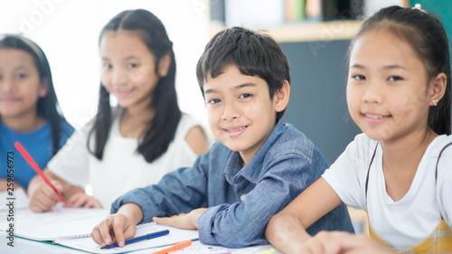 Asian primary student and teacher in the classroom