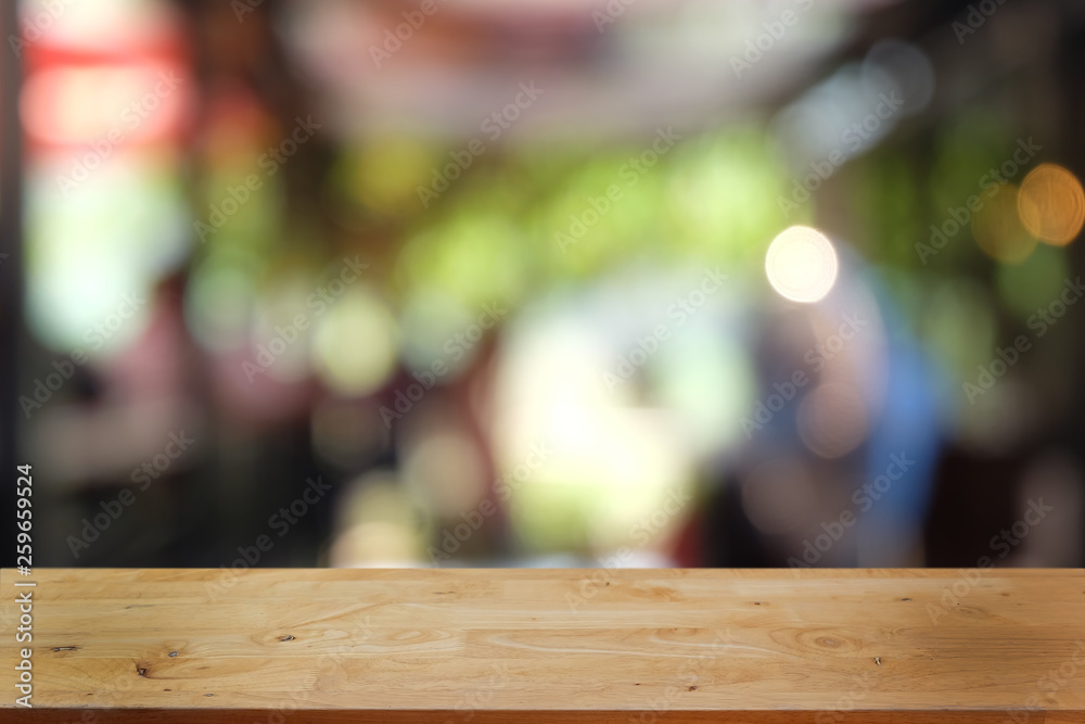 Empty dark wooden table in front of abstract blurred bokeh background of restaurant . can be used for display or montage your products.Mock up for space. Empty dark wooden table in front of abstract blurred bokeh background of restaurant . can be used for display or montage your products.Mock up for space.