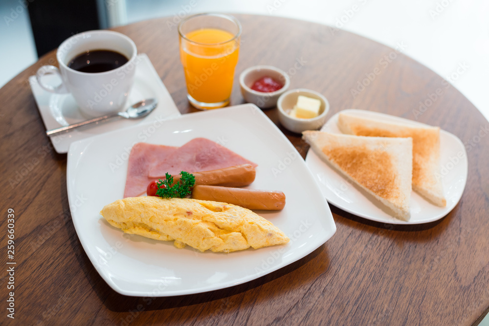 breakfast on table with Omelet, bread, coffee and juice breakfast on table with Omelet, bread, coffee and juice