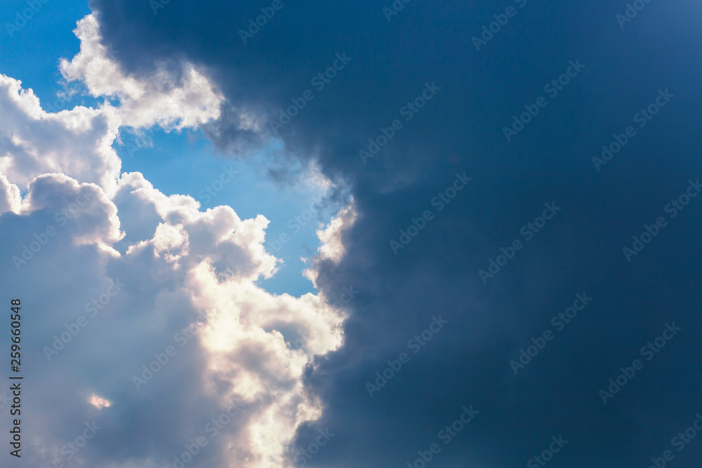 sun light shine through cloud on clear blue sky background