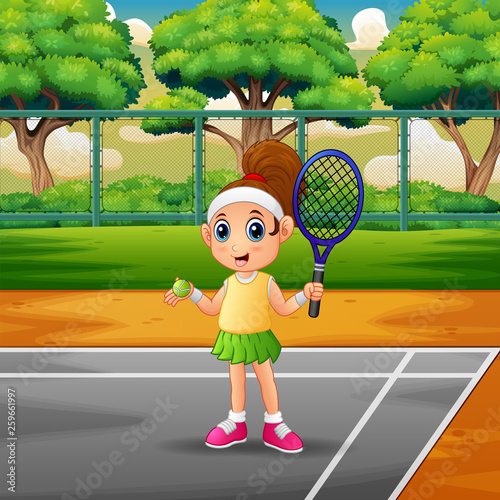 Happy girl playing tennis at the courts