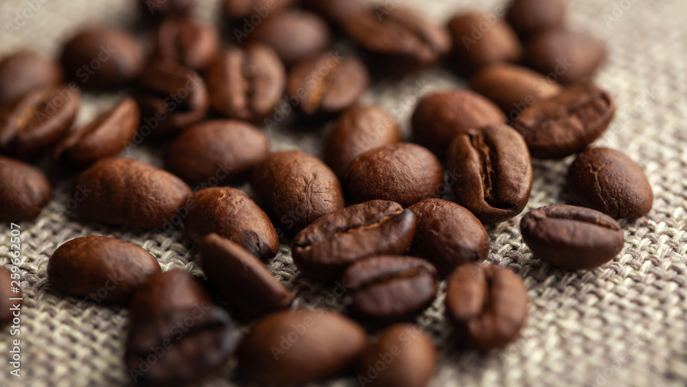 Close up of coffee beans on cloth sack Close up of coffee beans on cloth sack