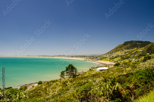 View from the Shipwreck Bay to the Ninety Mine Beach with blue sky above, Northland, New Zealand