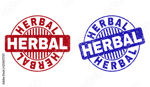 Grunge HERBAL round stamp seals isolated on a white background. Round seals with grunge texture in red and blue colors. Vector rubber imprint of HERBAL label inside circle form with stripes.