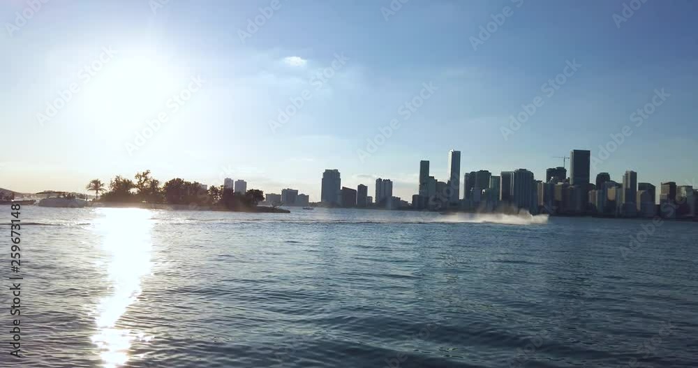 A jet ski speeds by next to Isla Neira on the Miami South Channel off