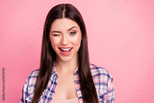 Close up photo amazing beautiful her she lady brown winking eye long straight hair wondered facial expression wear casual checkered plaid shirt clothes outfit isolated pink rose bright background