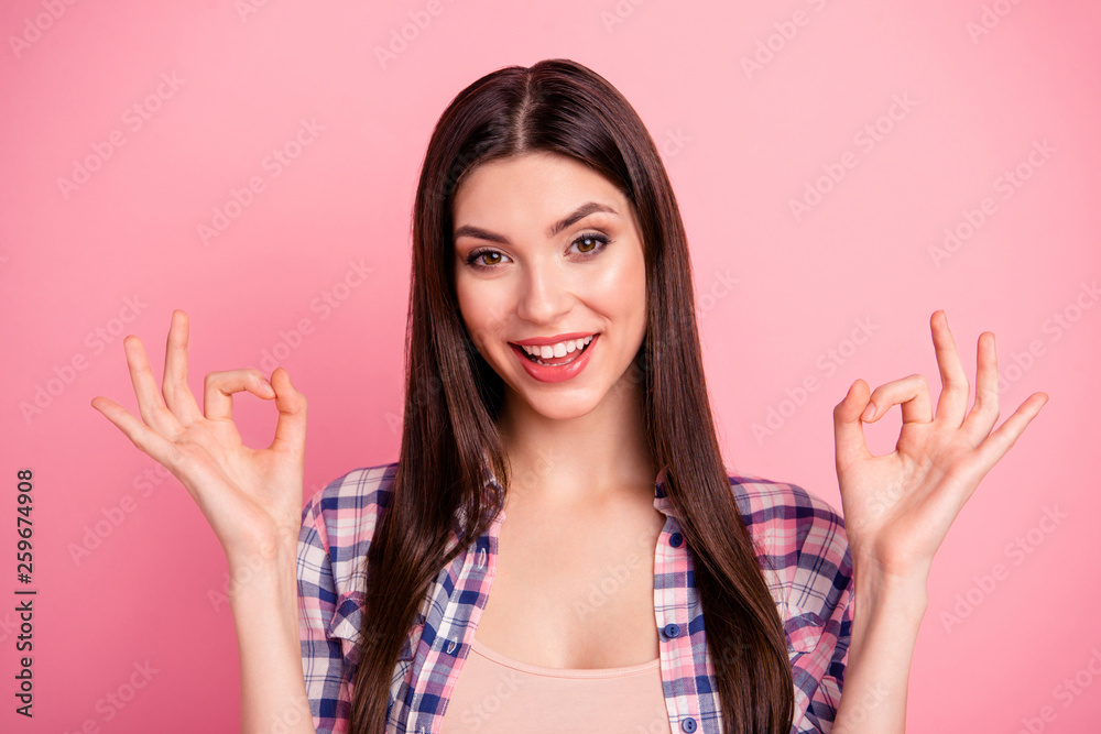 Close up photo amazing cheer her she lady hold both arms hands fingers okey symbol brown eyes long straight hair wear casual checkered plaid shirt clothes outfit isolated pink bright background Close up photo amazing cheer her she lady hold both arms hands fingers okey symbol brown eyes long straight hair wear casual checkered plaid shirt clothes outfit isolated pink bright background
