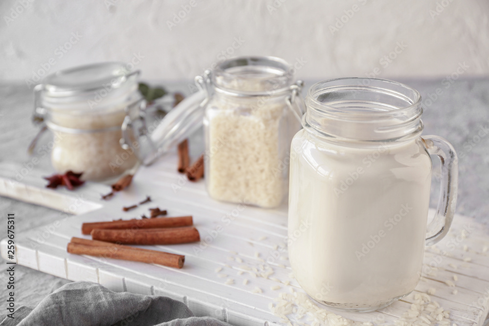 Mason jar of healthy rice milk on table Mason jar of healthy rice milk on table