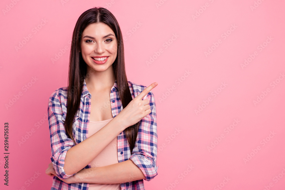 Close up photo amazing beautiful her she lady hand arm index finger indicate empty space novelty promotional advising wear casual checkered plaid shirt clothes outfit isolated pink background