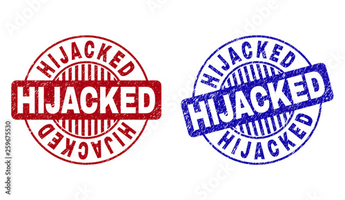 Grunge HIJACKED round stamp seals isolated on a white background. Round seals with grunge texture in red and blue colors. Vector rubber watermark of HIJACKED label inside circle form with stripes.