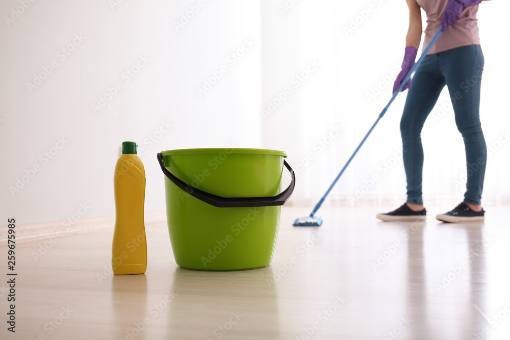 Fototapeta premium Cleaning of floor in room