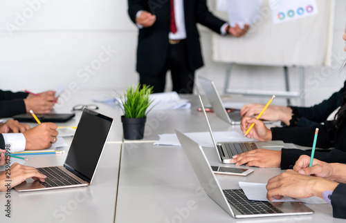 Senior leader speaker speaks to public people audience in training workshop or conference. Mature lecturer is CEO executive manager leading the symposium event. International business seminar concept.