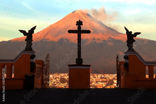 View of the active volcano Popokatepepetl from the Catholic Church of St. Mary. Mexico. Cholula city. photo