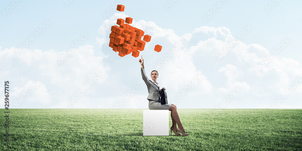 Attractive business lady or accountant outdoors on white box