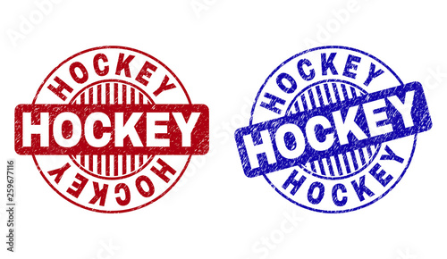 Grunge HOCKEY round stamp seals isolated on a white background. Round seals with grunge texture in red and blue colors. Vector rubber imprint of HOCKEY caption inside circle form with stripes.