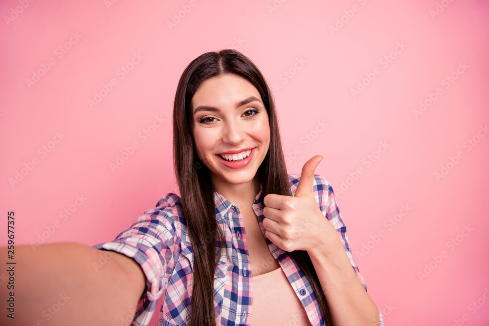 Self-portrait of her she nice-looking attractive cute charming shine winsome lovely cheerful straight-haired lady wearing checked shirt showing thumbup ad advert isolated on pink background Self-portrait of her she nice-looking attractive cute charming shine winsome lovely cheerful straight-haired lady wearing checked shirt showing thumbup ad advert isolated on pink background