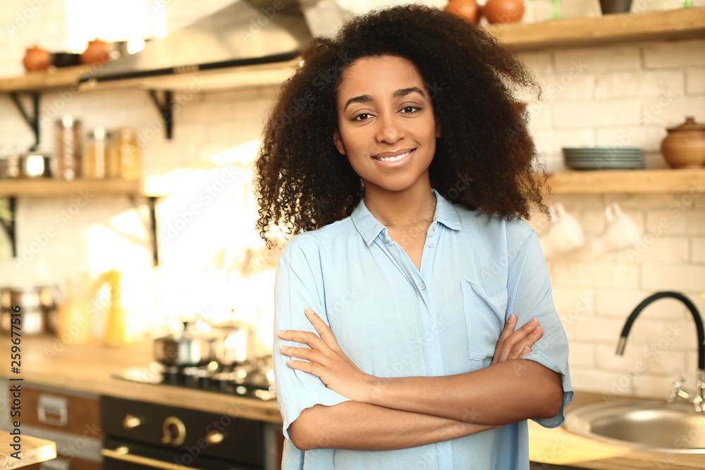 Portrait of African-American woman in kitchen Portrait of African-American woman in kitchen