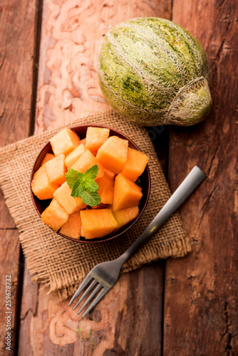 Cantaloupe / muskmelon / kharbuja cut into pieces, served in a bowl. selective focus photo