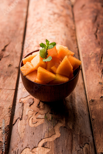 Cantaloupe / muskmelon / kharbuja cut into pieces, served in a bowl. selective focus photo