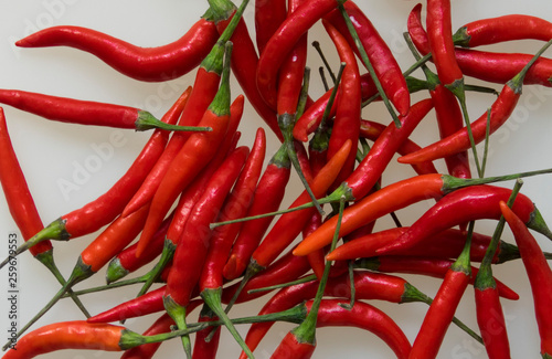 Close-up of red hot chili cayenne peppers handful 
