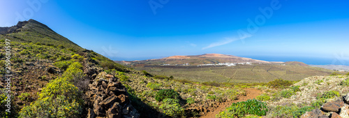 Spain, Lanzarote, XXL panorama of endless winegrowing and cactus fields from edge of volcano corona