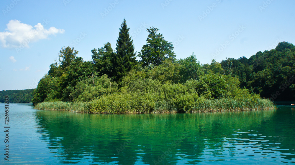 Crystal water and landscape with trees, Plitvice Lakes in Croatia, National Park, sunny day Crystal water and landscape with trees, Plitvice Lakes in Croatia, National Park, sunny day