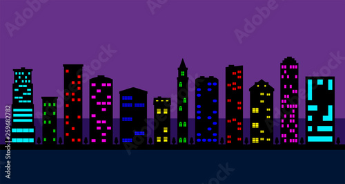 a set of black high-rise buildings with colored windows