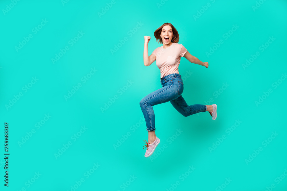 Full length side profile body size photo beautiful amazing her she lady flight jump high little prices rush hurry black friday wear casual jeans denim pastel t-shirt isolated teal turquoise background