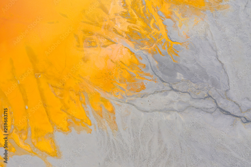 Aerial view of a mining decanting pond with toxic red residuals