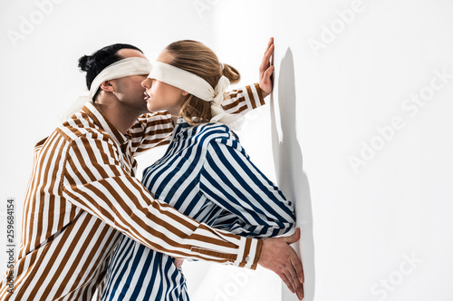 Wallpaper Mural Models wearing striped shirts and blindfolds posing together Torontodigital.ca