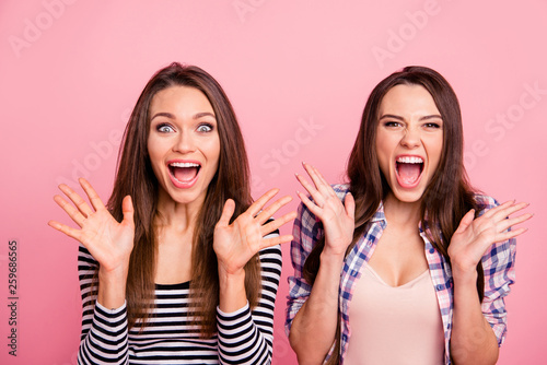 Close-up portrait of nice attractive fascinating cute charming crazy cool cheerful cheery overjoyed straight-haired girls showing excitement news having fun isolated over pink pastel background