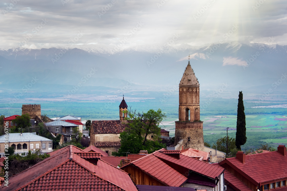 Scenic view on a roofs of ancient buildings of Sighnaghi, Georgia. Alazani Valley and Caucasus mountain range