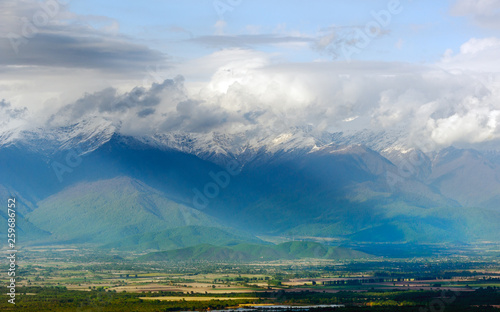 Scenic view on a Alazani Valley and Caucasus mountain range in Georgia photo