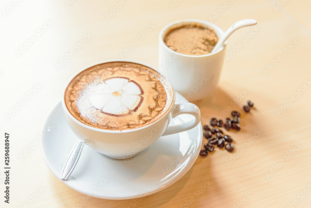 hot cappuccino coffee with nice pattern foam on table hot cappuccino coffee with nice pattern foam on table