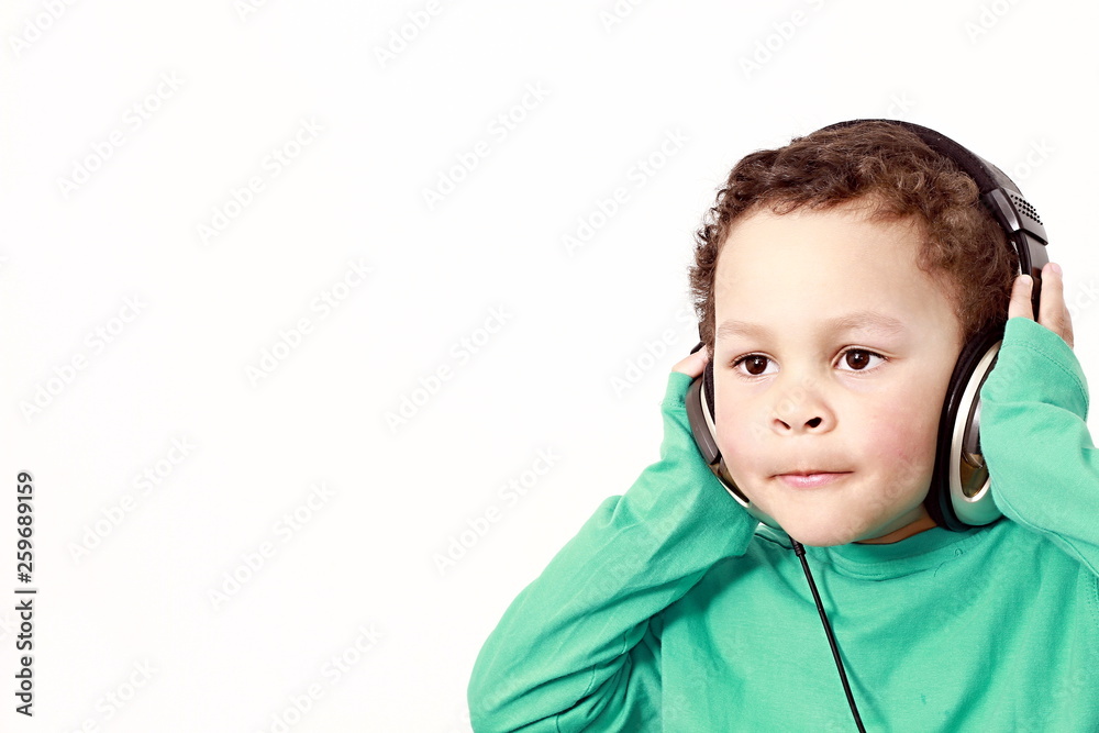 little boy with headphones enjoying disco music with white background little boy with headphones enjoying disco music with white background