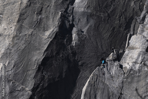Climbers attempt to climb jagged granite of El Capitan in Yosemite National Park